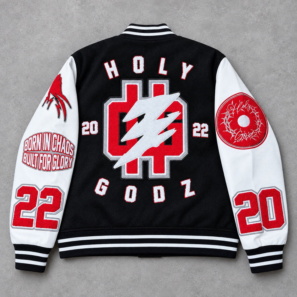 Holy Godz Born in Chaos Built for Glory varsity jacket back view with oversized HG artwork
